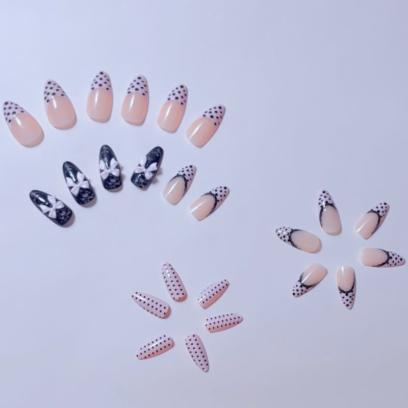 Elegant artificial nails with lace design and bow accents Bowlift