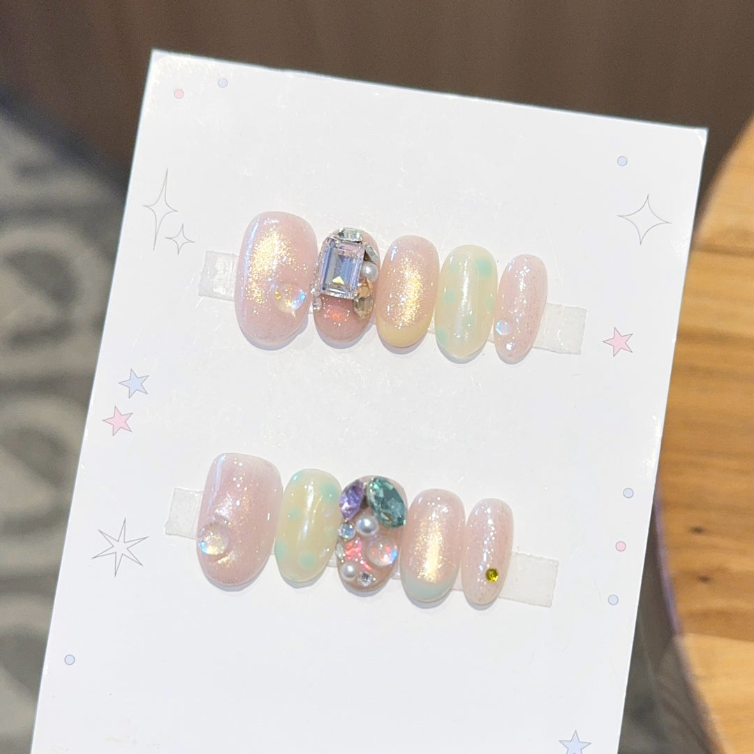 Artificial nails with shimmering effects and crystal accents Bowlift