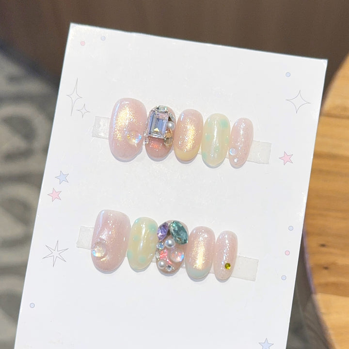 Artificial nails with shimmering effects and crystal accents Bowlift