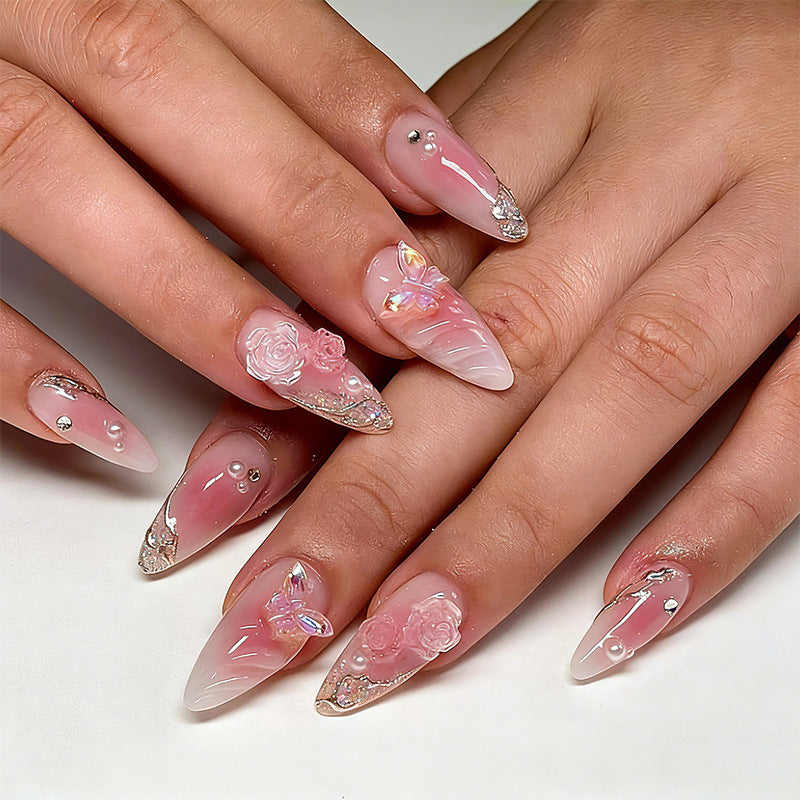 Artificial nail creation with floral 3D details and glitter accents Bowlift