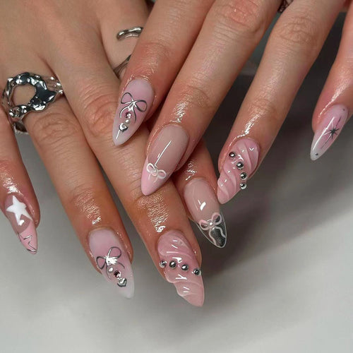 Artistic Nail Art with decorative bows and glitter accents Bowlift