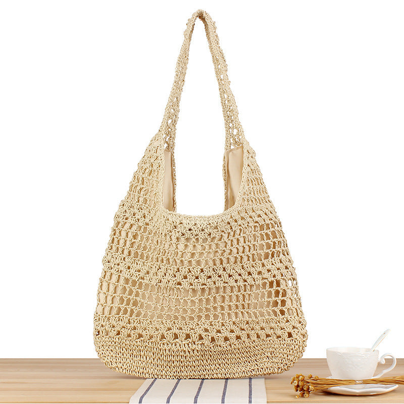 Handbag with floral appliqué Made of natural material Bowlift