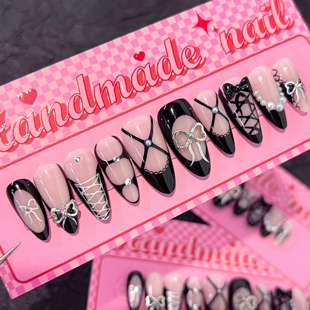Artful nail art with elegant bows and glitter accents Bowlift