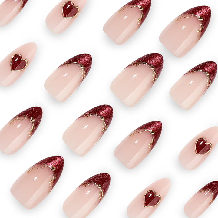 Artful stiletto nails with heart designs and glitter embellishment Bowlift