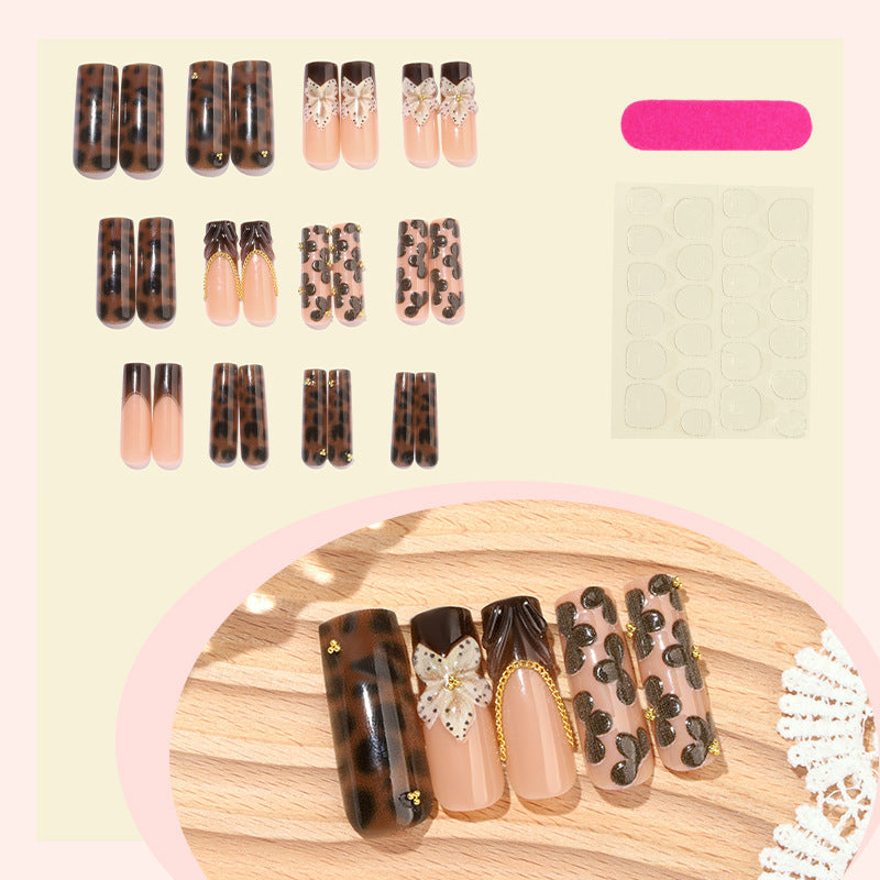 Nail design with floral accents and elegant details Bowlift