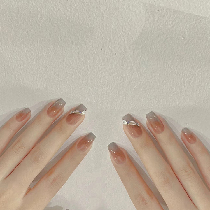 Artificial nail set with elegant ombre design and sparkling applications Bowlift