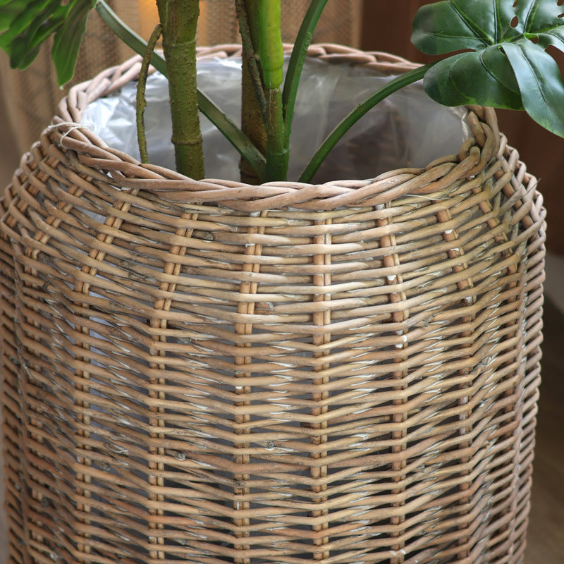 Stylish laundry basket made of braided natural material Bowlift