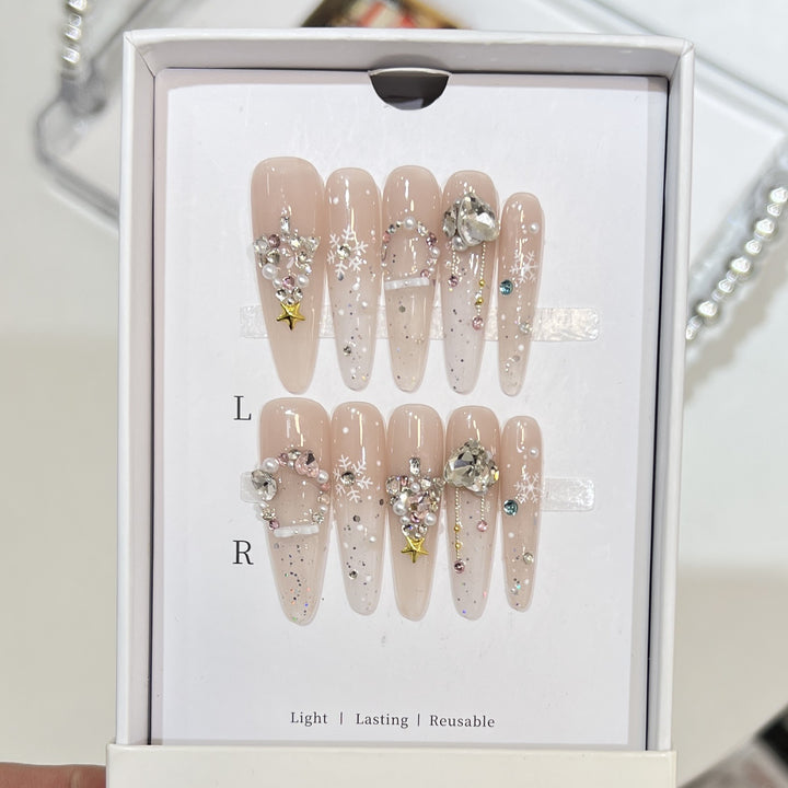 Artistic Press-On Nail Set with Snowflake and Gemstone Designs Bowlift