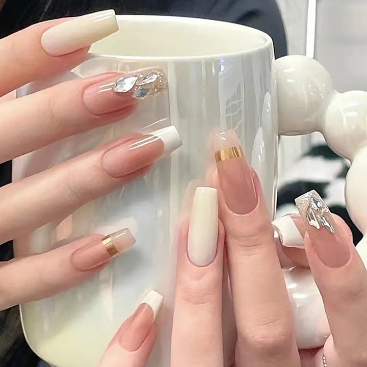 Elegant Long Press-On Nails with Rhinestone and Gold Accents Bowlift