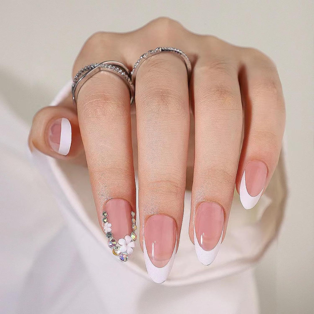 Artificial nails with elegant French tips and rhinestone details Bowlift