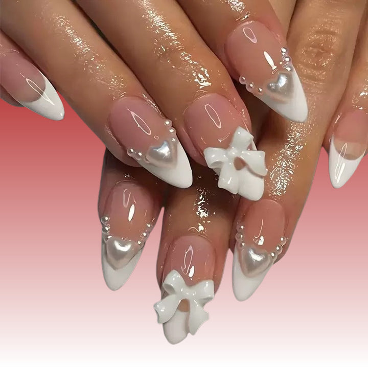 Elegant artificial nails with curved tips and decorative bows Bowlift