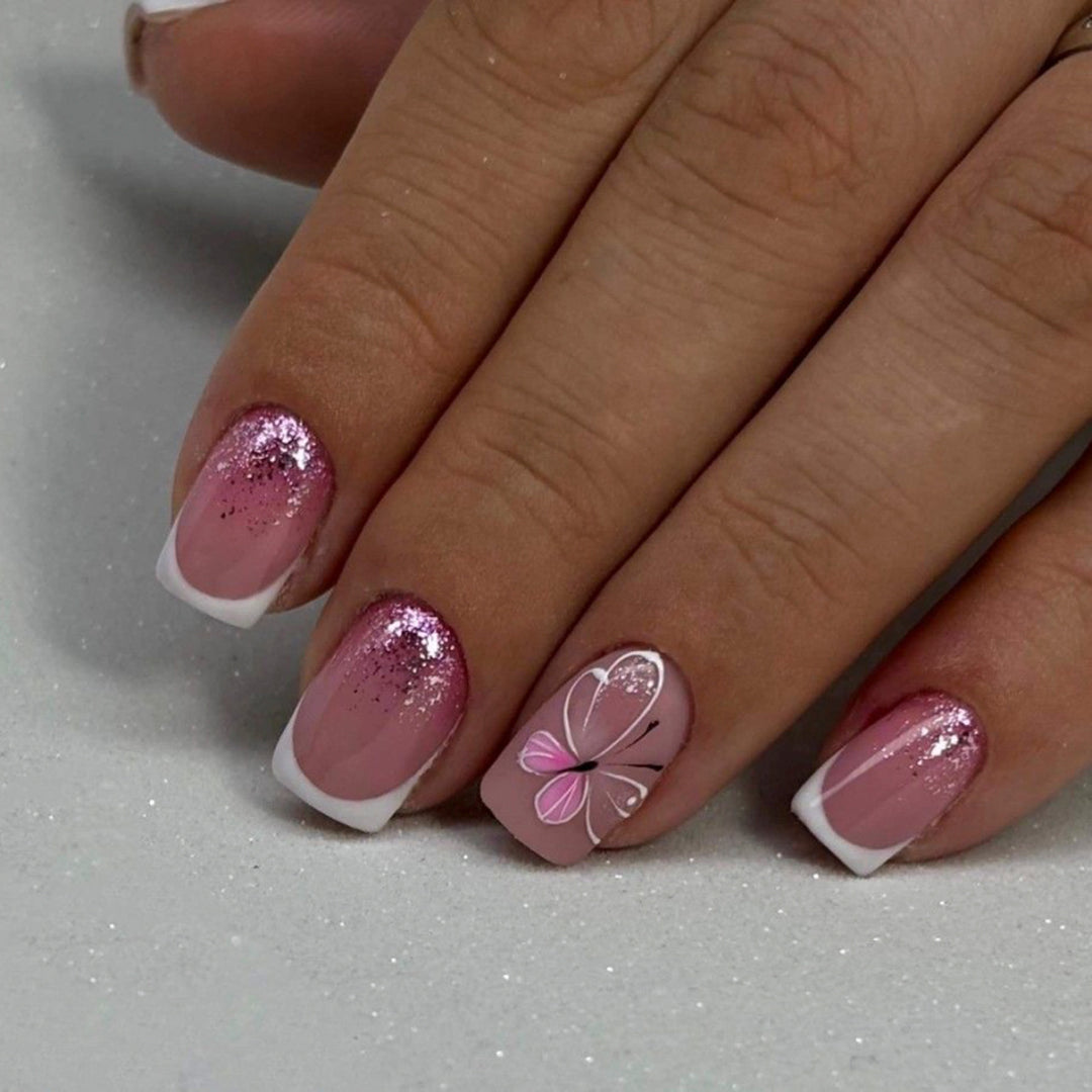Artistic nail art with glitter and butterfly design Bowlift