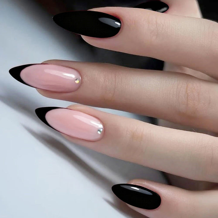 Acrylic nail set with elegant black-pink design and rhinestone-embellished accents Bowlift