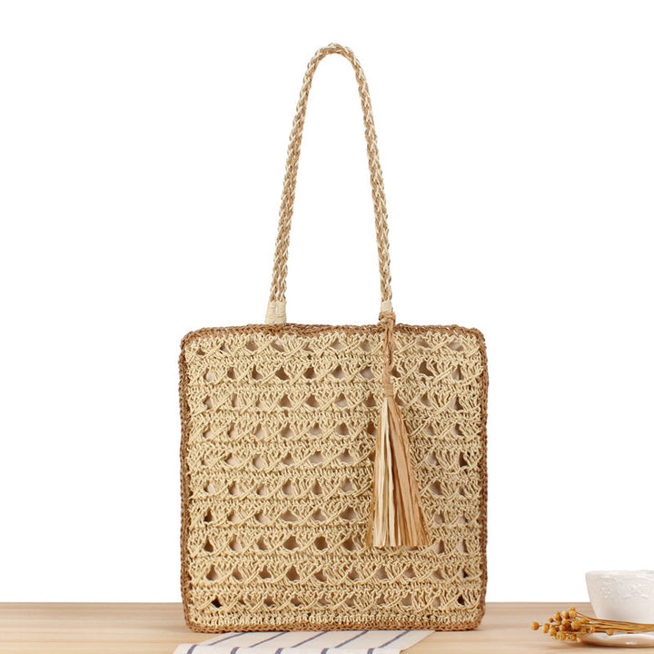 Handbag Made of Hand-Woven Natural Material with Appealing Tassel Detail Bowlift