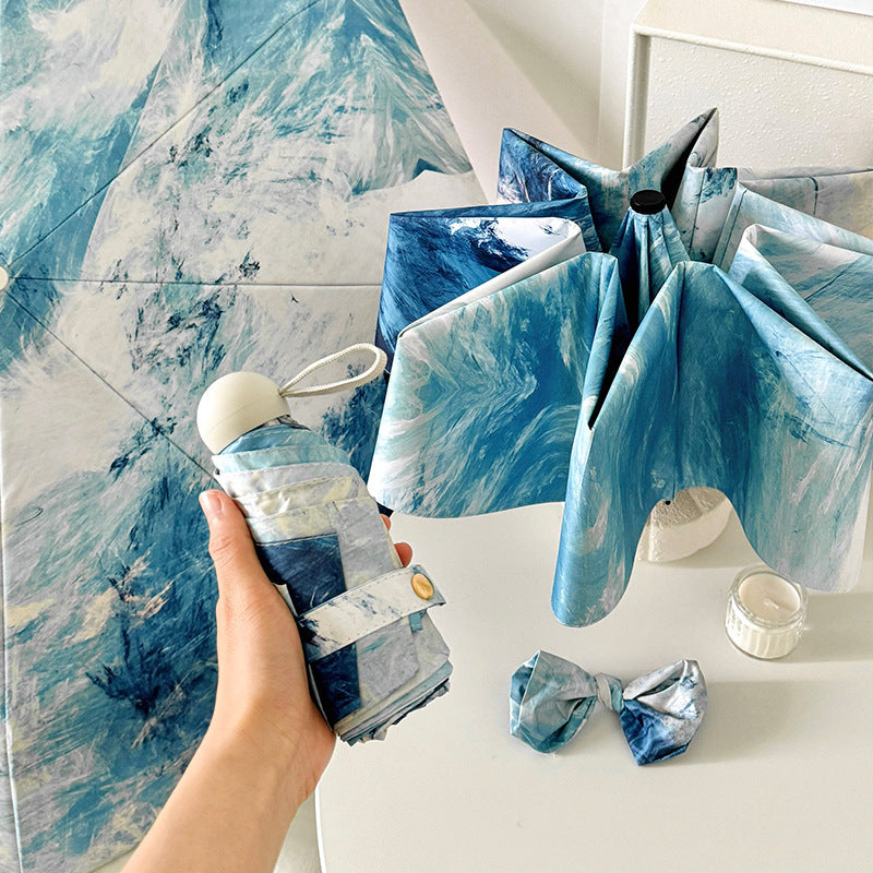 Ladies elegant folding umbrella with unique marble pattern Bowlift