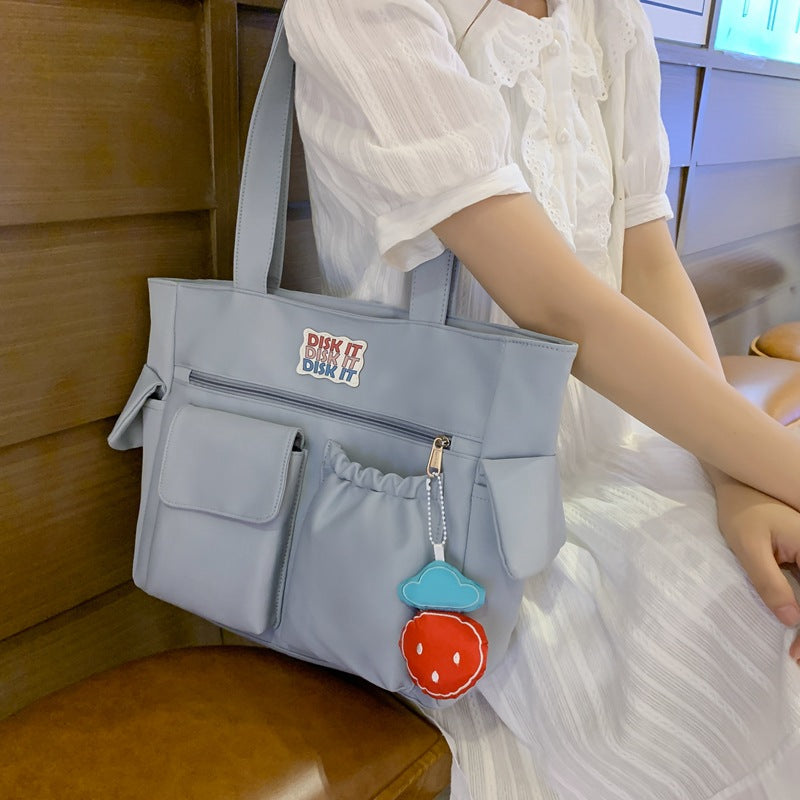 Tote bag with versatile compartments and ergonomic design Bowlift