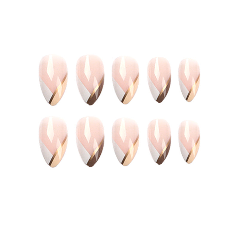 Artful nail art in elegant stiletto design with golden accents Bowlift
