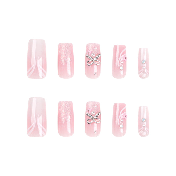Artistic acrylic nails with elegant jewelry accents Bowlift