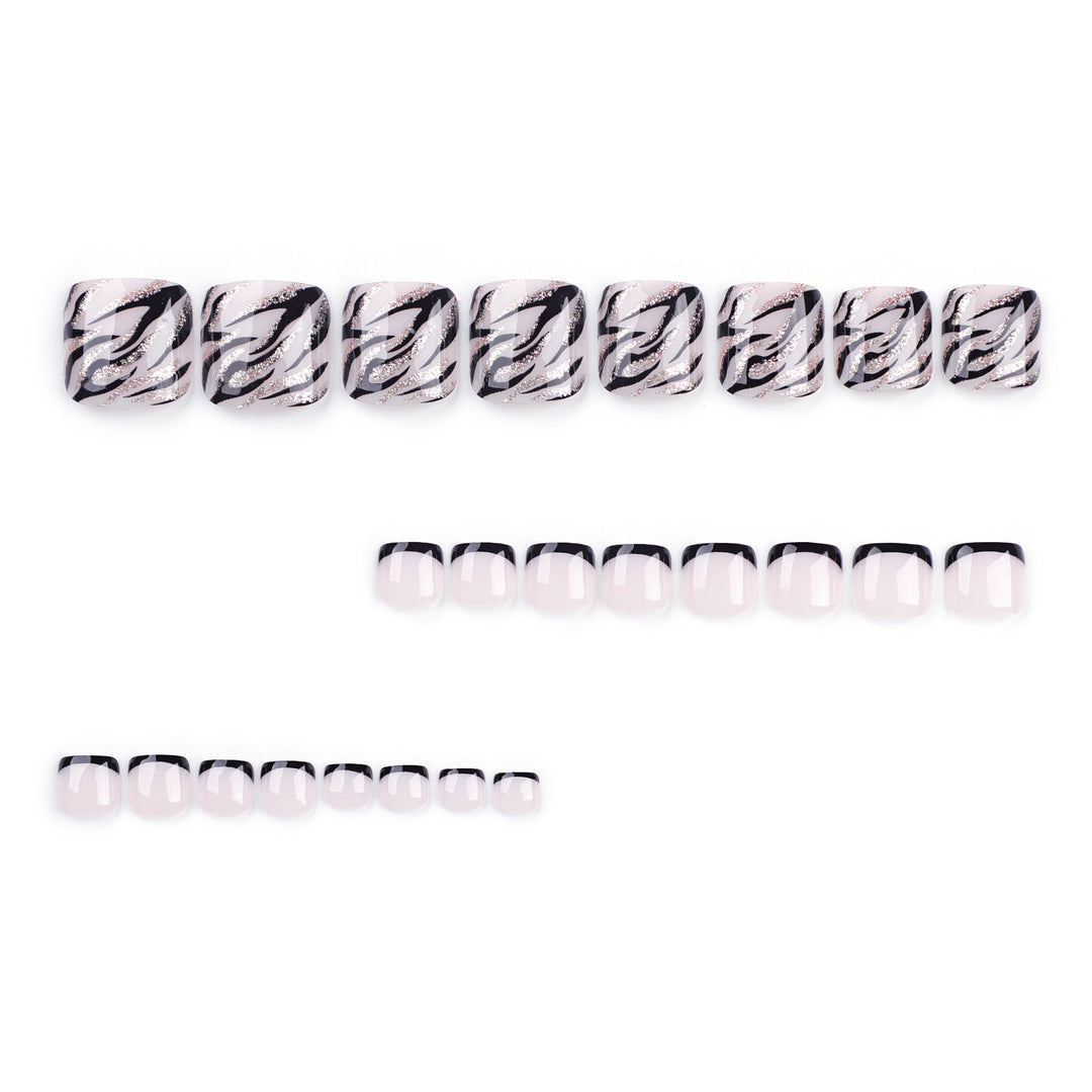 Artificial toenail art in elegant black and white design Bowlift