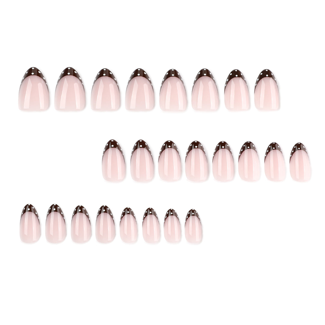Artful nail art with elegant French tips and glitter accents Bowlift