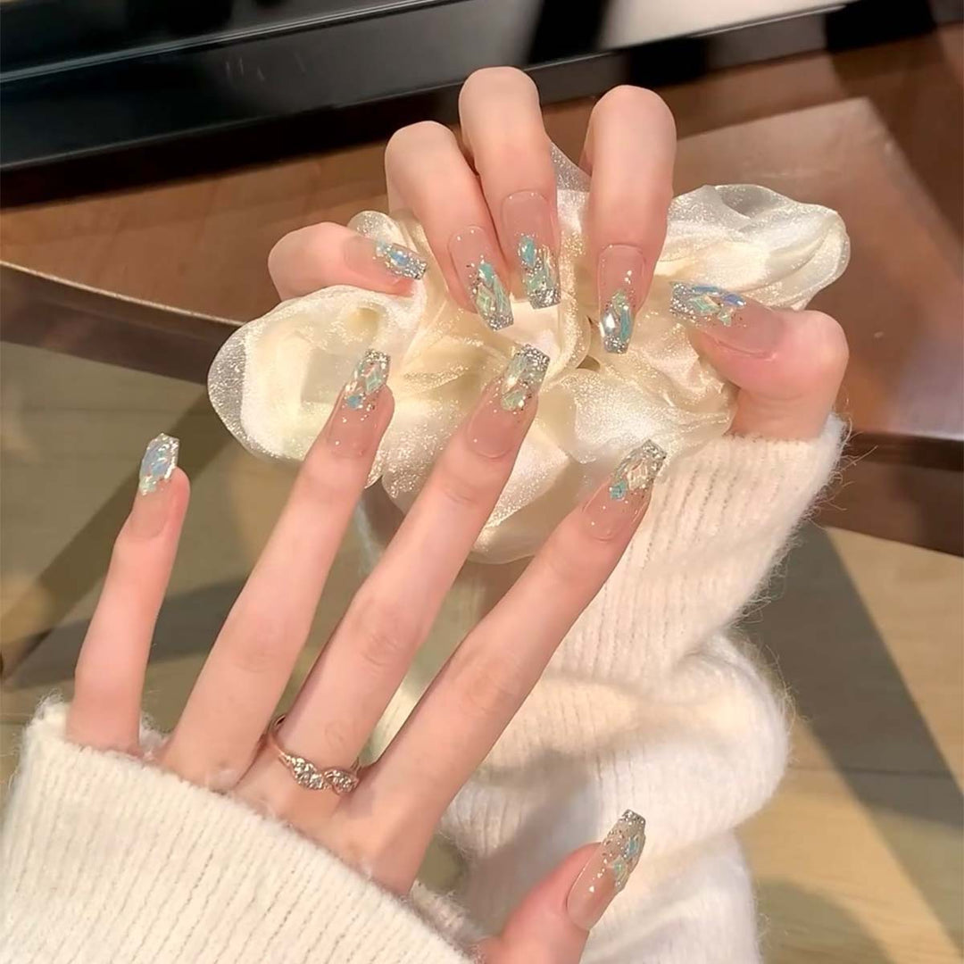 Glamorous nail tips with glitter accents Bowlift