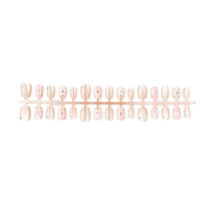 Artificial nail set with floral accents and glitter Bowlift