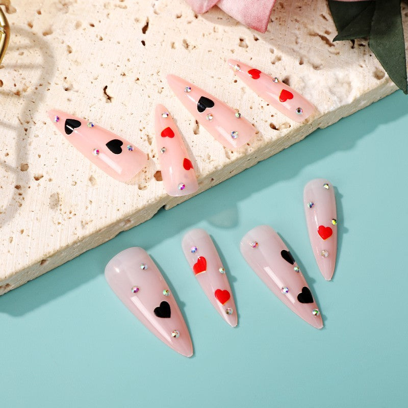 Glamorous artificial nails with heart accents Bowlift