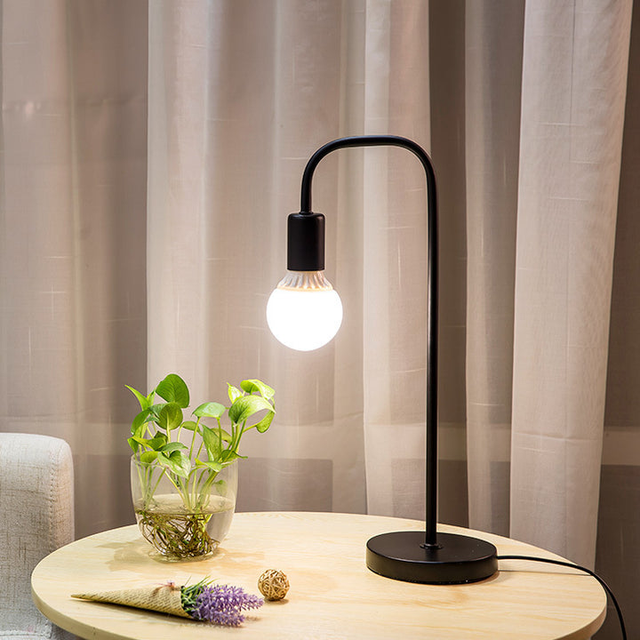 Minimalist Curved-Arm Table Lamp with Round Base and Standard Bulb Socket Bowlift