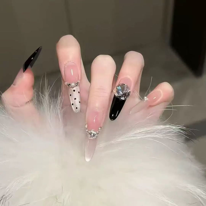 Acrylic nail set with elegant tips and glamorous rhinestone accents Bowlift