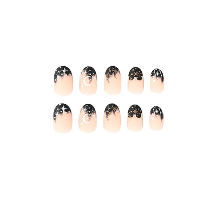 Artistic nail art with moon and star motifs Bowlift