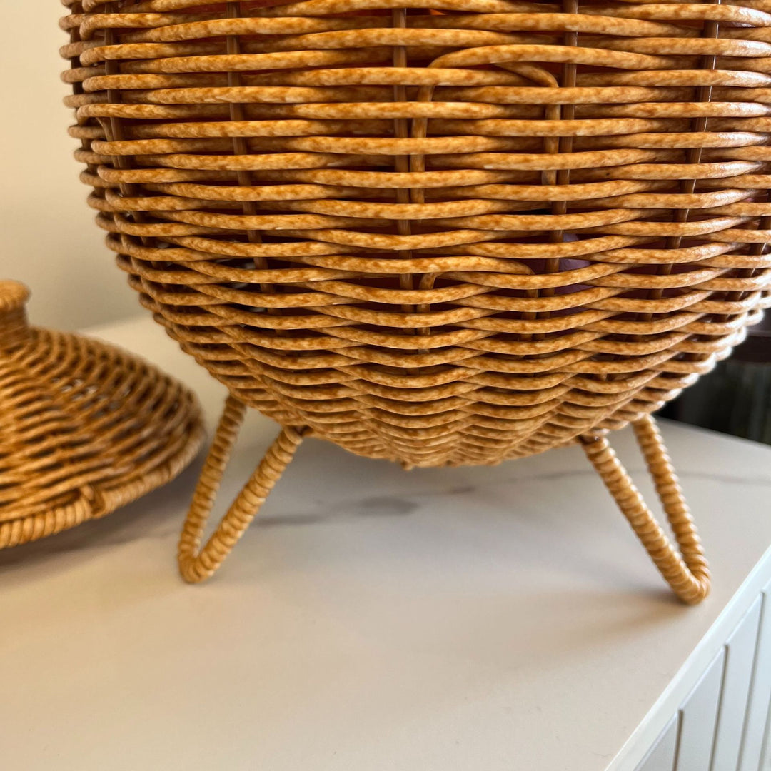 Women artfully woven storage pot Bowlift