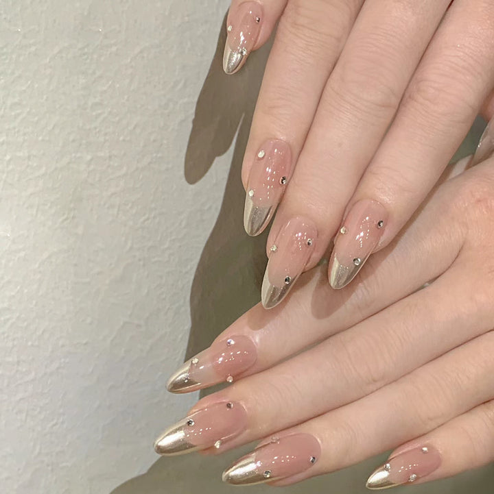Artificial nail set with elegant metallic shades and rhinestone decorations Bowlift