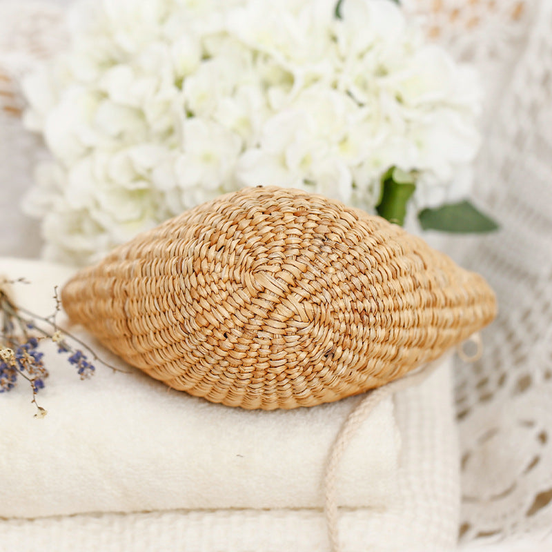 Handcrafted straw clutch with elegant design Bowlift