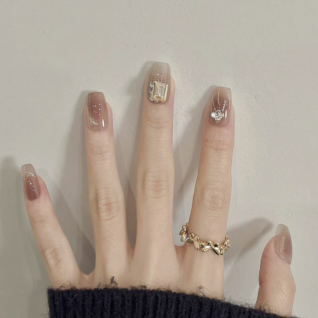 Artificial nail art with elegant jewelry accents Bowlift