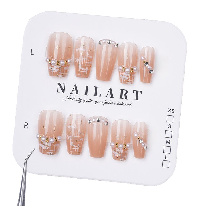 Elegant Press-On Nail Design with Decorative Accents Bowlift