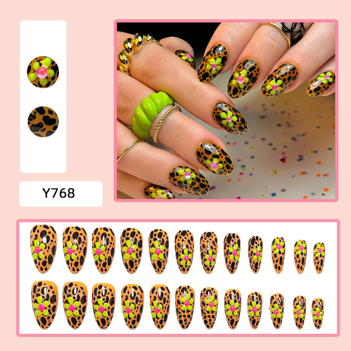 Glamorous nail art with leopard pattern and flower appliqués Bowlift