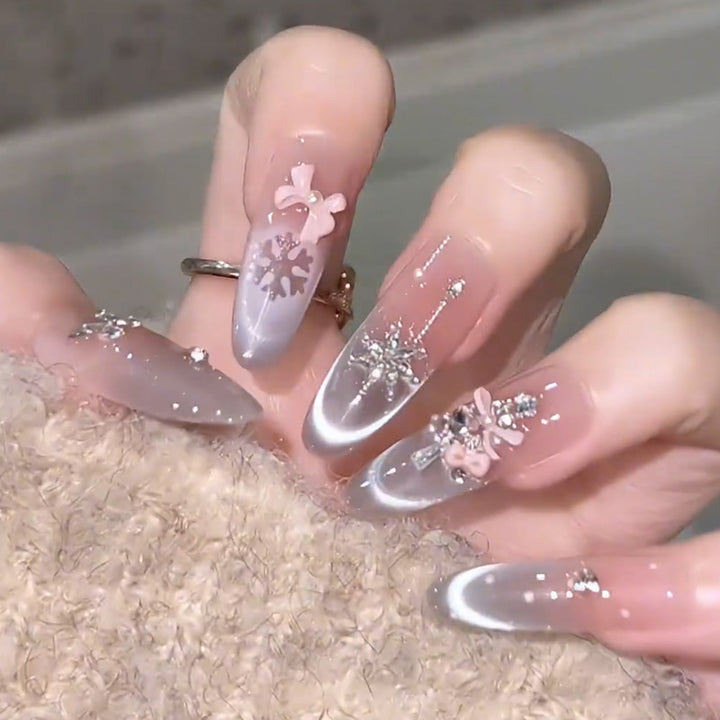 Artificial nail set with festive gift design and elegant glitter accents Bowlift