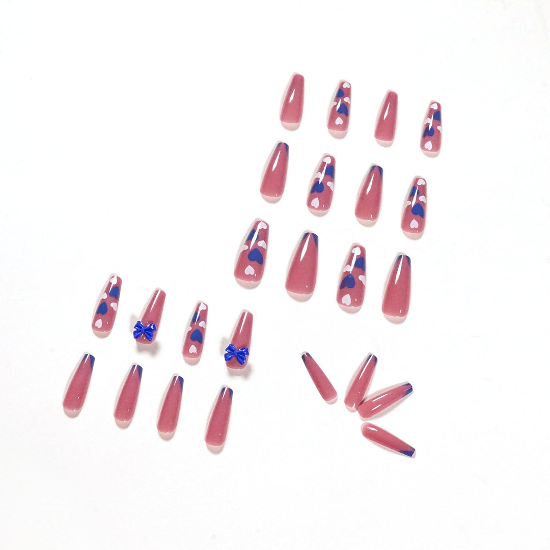 Artful stiletto nails with modern heart and bow motifs Bowlift