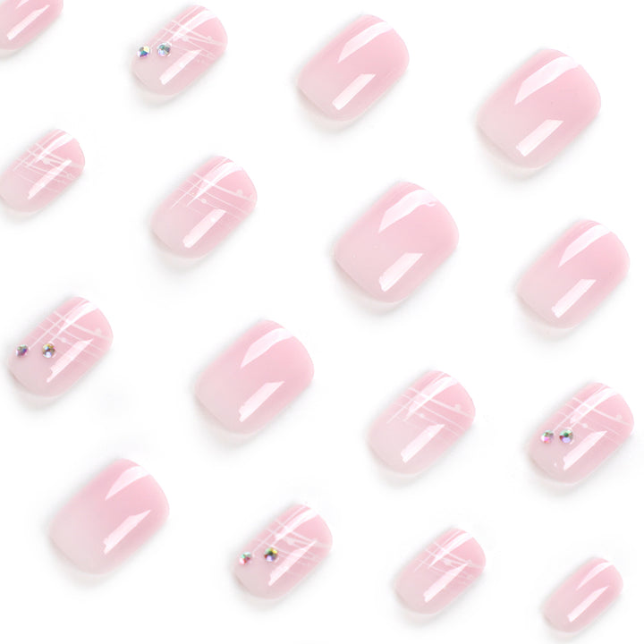 Artful nail extensions with elegant design and rhinestone embellishments Bowlift