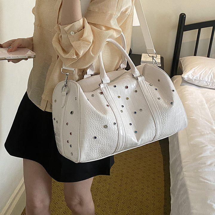 Fashionable travel bag with structured surface and versatile interior Bowlift