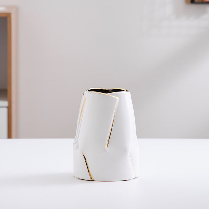 Decorative ceramic vase with golden accents Bowlift