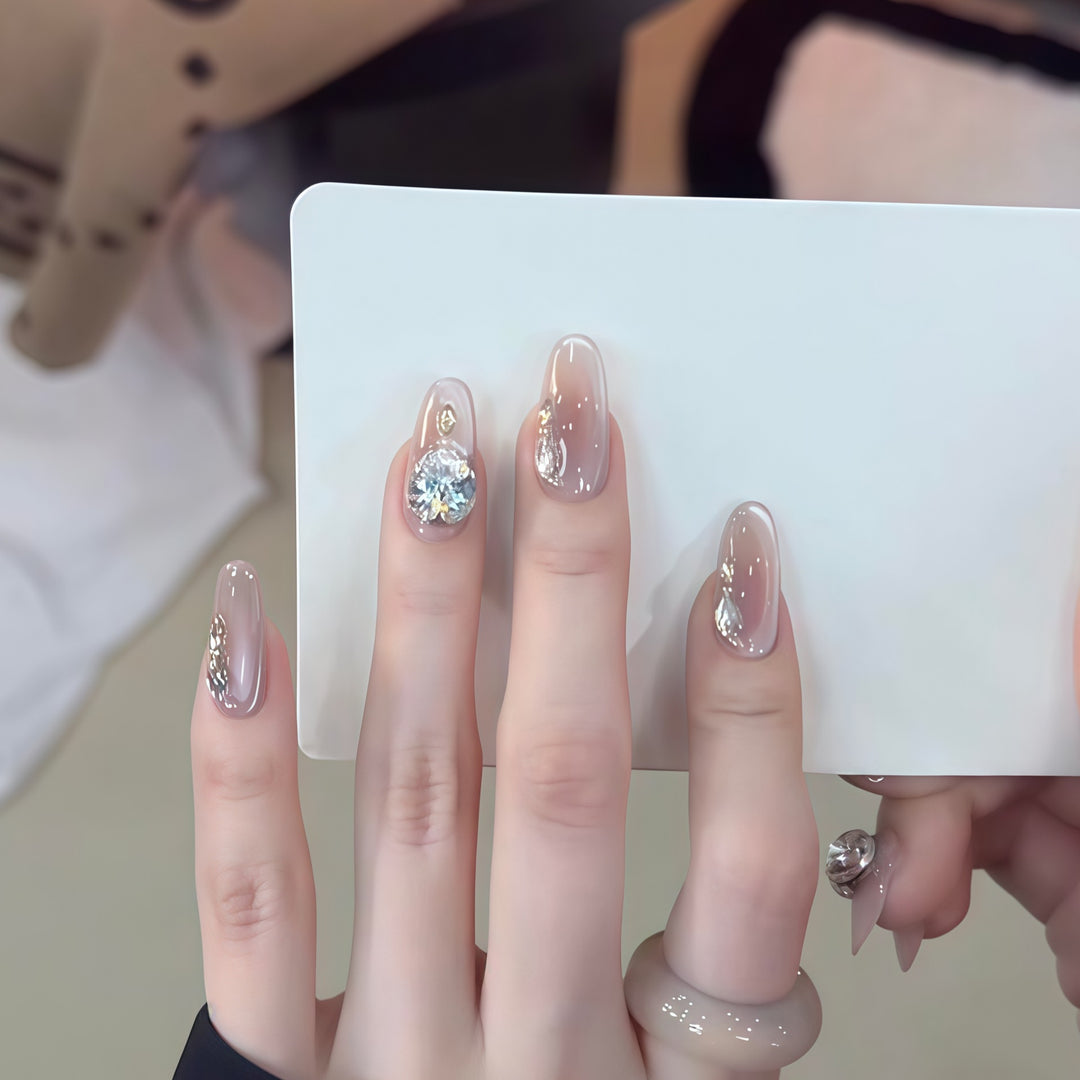 Glamorous artificial nails with rhinestone embellishments Bowlift