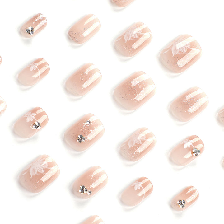 Elegant Nail Art with Holographic Accents and Floral Embellishments Bowlift