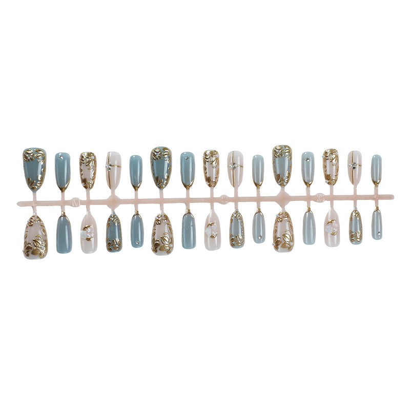 Artificial nail set with floral gold embellishments Bowlift