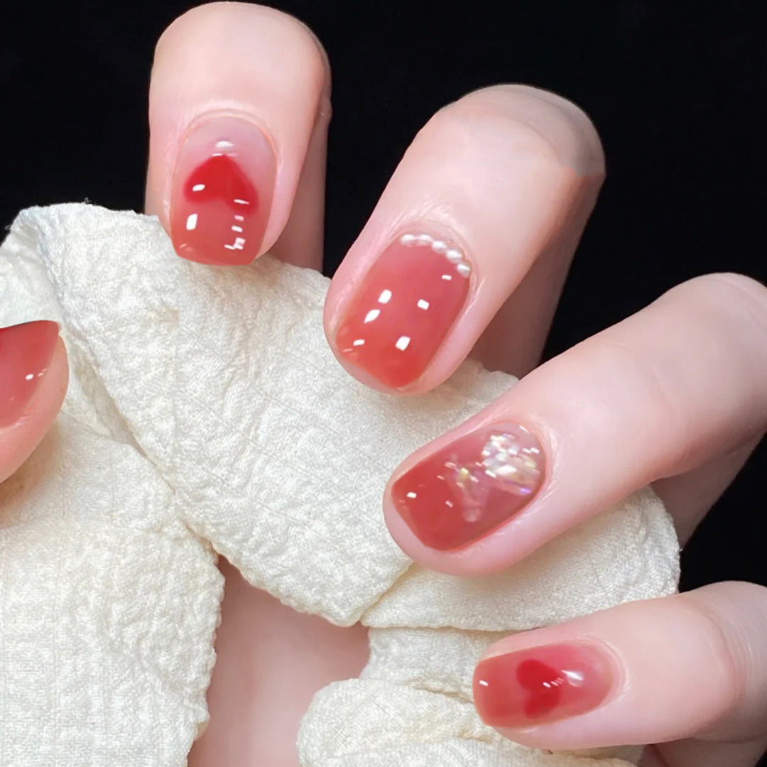 Artful nail art with radiant shine and heart motifs Bowlift