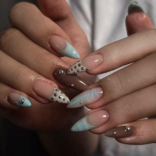 Artificial stiletto nails with glamorous applications Bowlift