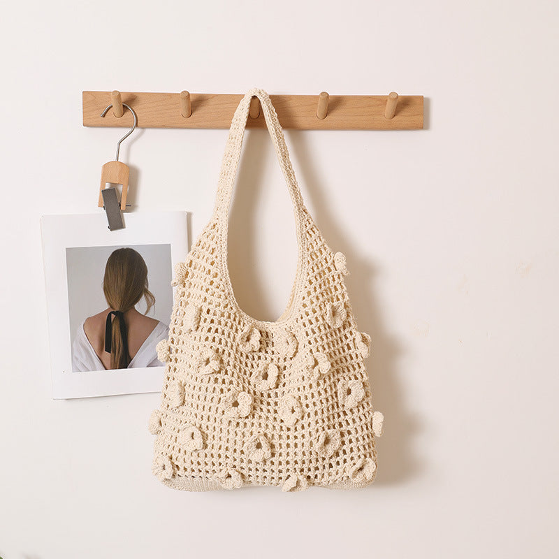 Hand-knotted shoulder bag with floral structural elements Bowlift