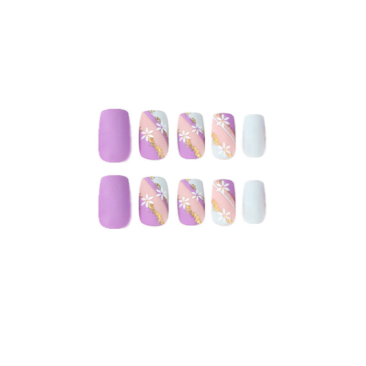 Artistic nail designs with floral motifs and glitter accents Bowlift