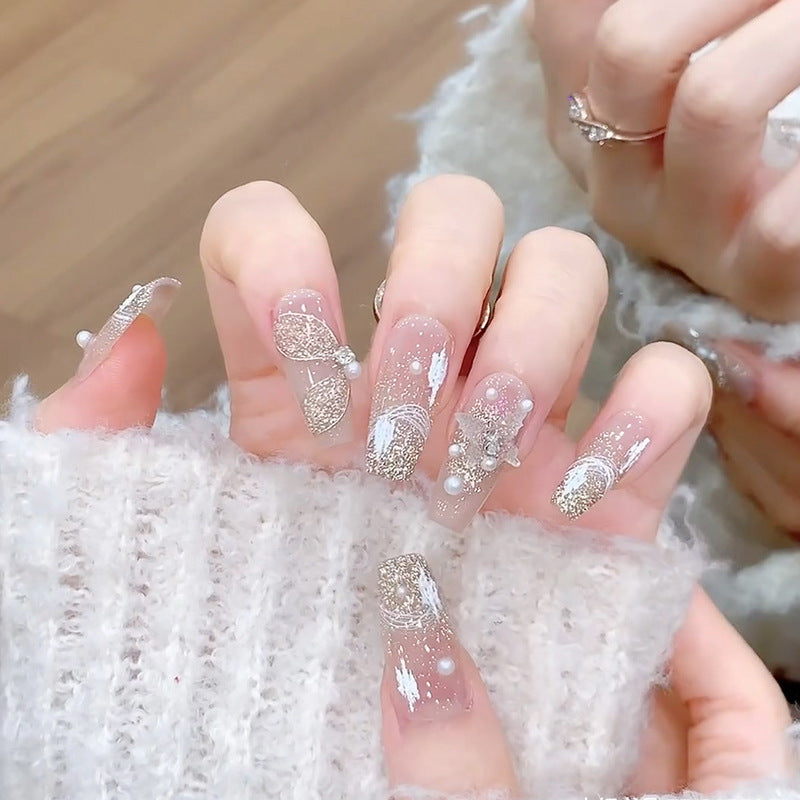 Glamorous artificial nails with heart-shaped accents Bowlift