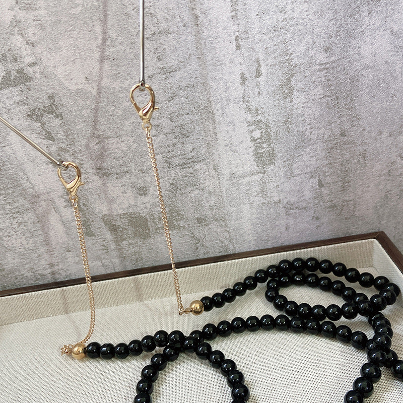 Fashionable jewelry band made of onyx beads Bowlift